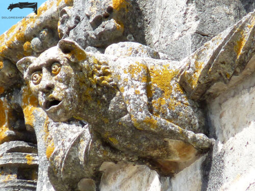 Gargoyle on the Convent of Christ in Tomar (Portugal). An anthropomorphic figure.