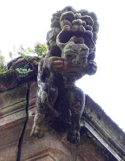 Demon gargoyle of the Monastery of San Martín Pinario in Santiago de Compostela. It is holding a mask in its hands.